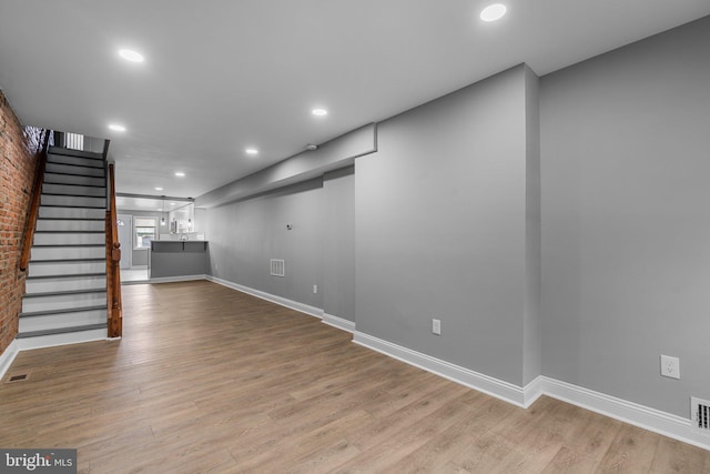 1213 Washington Blvd, Baltimore, MD 21230 - basement with stairs, wood finished floors, baseboards, and recessed lighting