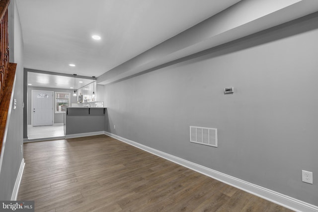 1213 Washington Blvd, Baltimore, MD 21230 - unfurnished living room with recessed lighting, dark wood-style floors, and baseboards