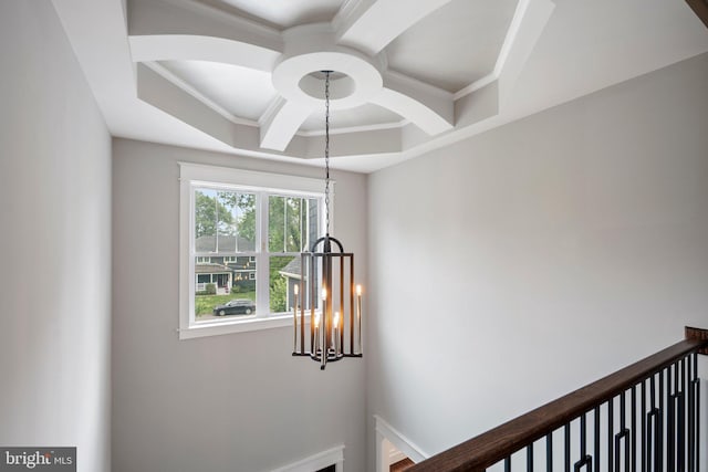 room details featuring an inviting chandelier, coffered ceiling, crown molding, and beamed ceiling