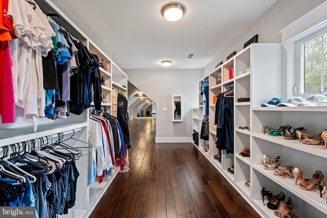spacious closet with visible vents and dark wood-type flooring