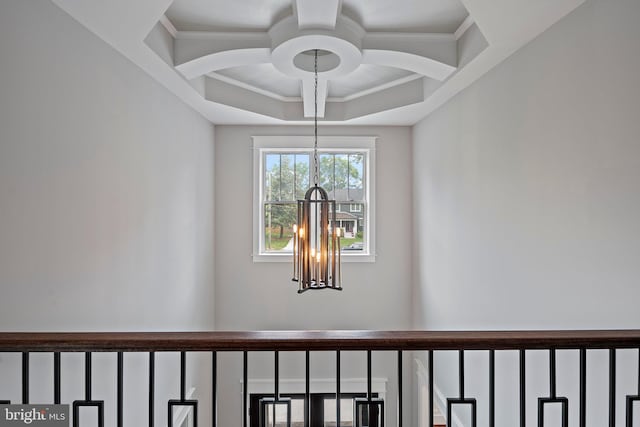room details with ornamental molding and a notable chandelier
