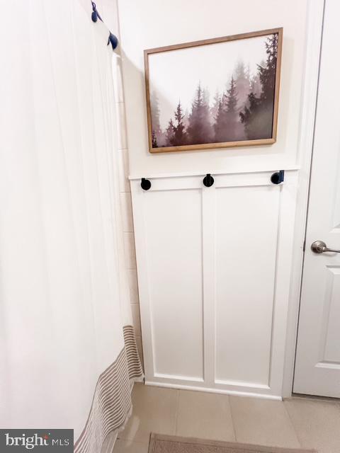 mudroom with light tile patterned floors