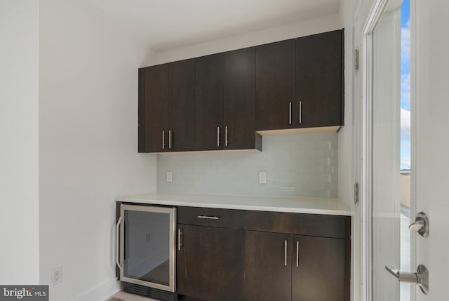 740 S Columbus Blvd Unit 74, Philadelphia, PA 19147 - kitchen featuring wine cooler, tasteful backsplash, light countertops, and dark brown cabinetry