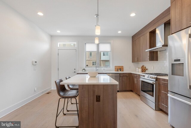 740 S Columbus Blvd Unit 74, Philadelphia, PA 19147 - kitchen with appliances with stainless steel finishes, wall chimney exhaust hood, modern cabinets, light wood-style flooring, and recessed lighting
