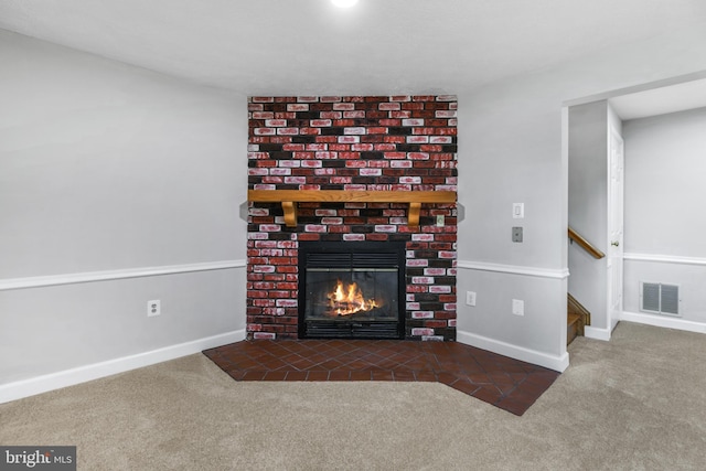 interior space featuring a fireplace, baseboards, carpet, and visible vents
