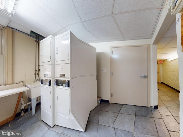 4408 1st Pl NE Unit 14, Washington, DC 20011 - community laundry room with stacked washer and clothes dryer and light tile patterned flooring