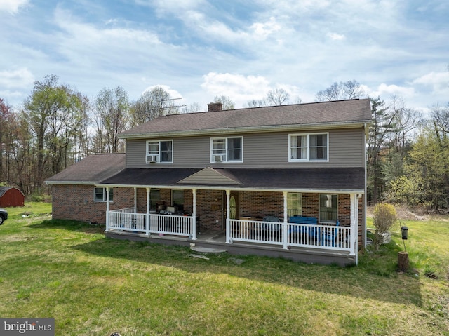 505 Deibler Rd, Pennsylvania Furnace, PA 16865 - view of front of house with brick siding, a front yard, covered porch, and a chimney