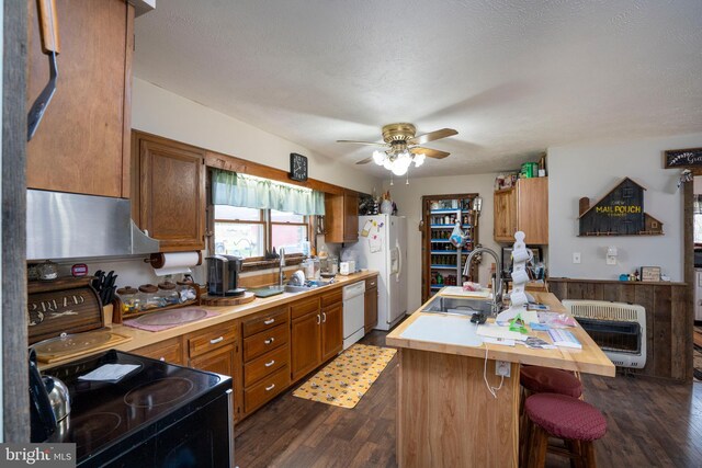 505 Deibler Rd, Pennsylvania Furnace, PA 16865 - kitchen featuring heating unit, dark wood-style flooring, white appliances, ventilation hood, and a sink