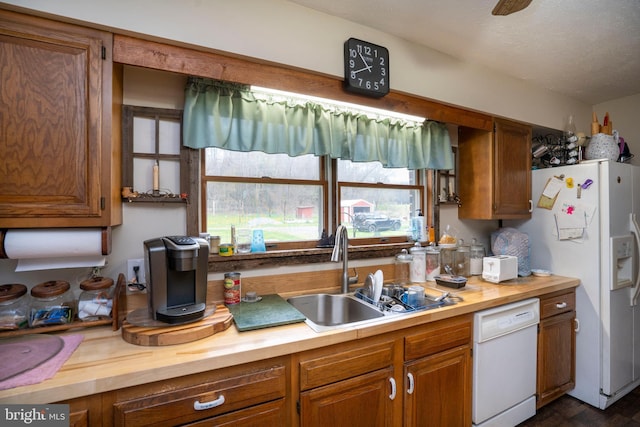 505 Deibler Rd, Pennsylvania Furnace, PA 16865 - kitchen featuring brown cabinetry, a sink, wood counters, and white appliances