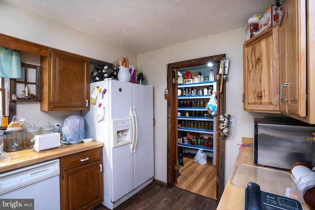 505 Deibler Rd, Pennsylvania Furnace, PA 16865 - kitchen featuring dark wood-style flooring, white appliances, a textured ceiling, brown cabinetry, and butcher block counters