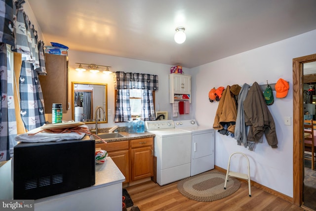 505 Deibler Rd, Pennsylvania Furnace, PA 16865 - clothes washing area featuring baseboards, light wood-type flooring, washing machine and clothes dryer, a sink, and cabinet space
