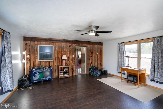505 Deibler Rd, Pennsylvania Furnace, PA 16865 - interior space featuring wood finished floors, baseboards, wooden walls, a textured ceiling, and a ceiling fan