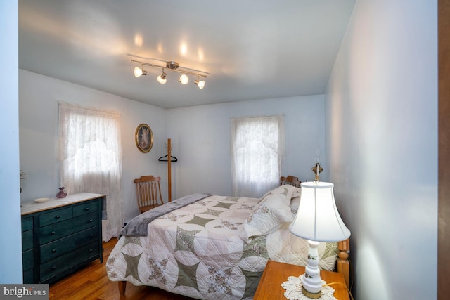 505 Deibler Rd, Pennsylvania Furnace, PA 16865 - bedroom with multiple windows and wood finished floors