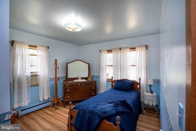 505 Deibler Rd, Pennsylvania Furnace, PA 16865 - bedroom with a baseboard radiator and wood finished floors