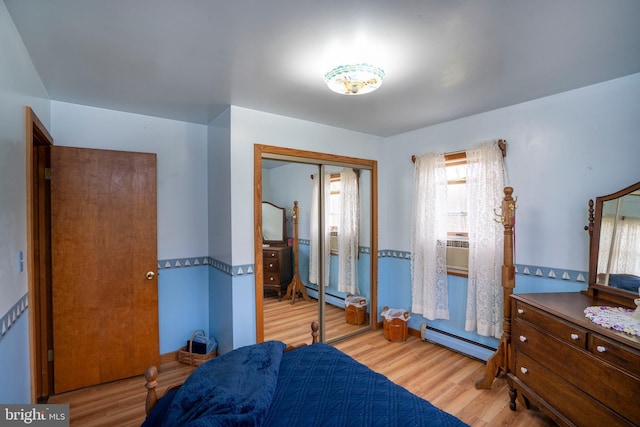 505 Deibler Rd, Pennsylvania Furnace, PA 16865 - bedroom featuring a baseboard heating unit, a baseboard radiator, wood finished floors, and a closet