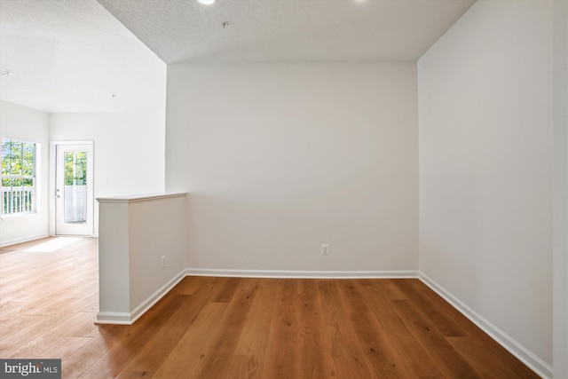 1704 Lake Shore Crest Dr Unit 32, Reston, VA 20190 - spare room featuring baseboards and wood finished floors