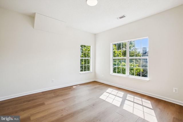 1704 Lake Shore Crest Dr Unit 32, Reston, VA 20190 - spare room featuring wood finished floors and baseboards