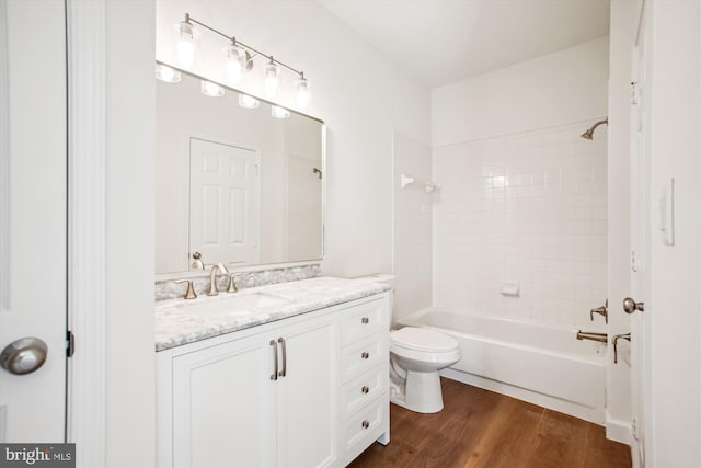 1704 Lake Shore Crest Dr Unit 32, Reston, VA 20190 - bathroom featuring wood finished floors, toilet, vanity, and bathing tub / shower combination