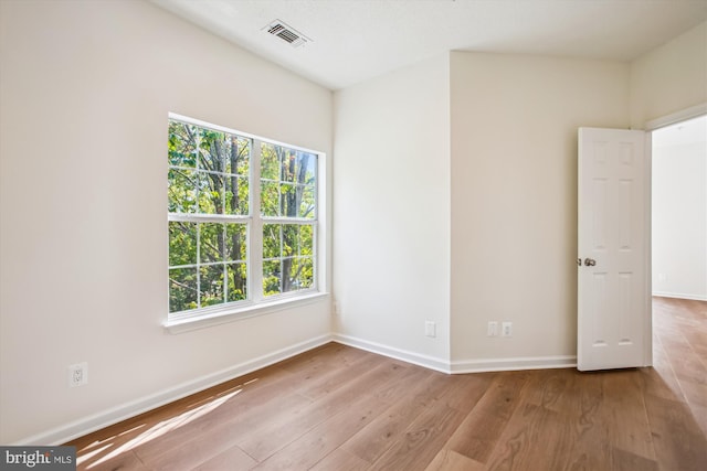 1704 Lake Shore Crest Dr Unit 32, Reston, VA 20190 - empty room featuring hardwood / wood-style flooring, healthy amount of natural light, and baseboards