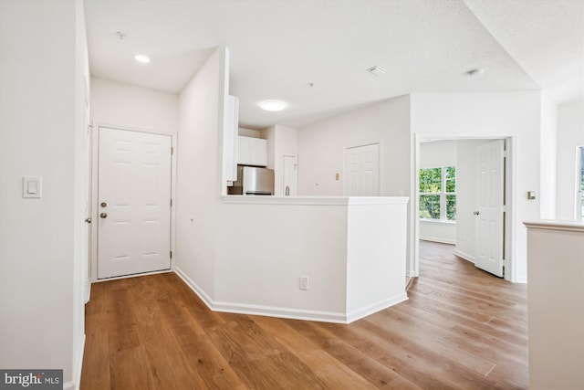 1704 Lake Shore Crest Dr Unit 32, Reston, VA 20190 - entryway featuring light wood finished floors, baseboards, and recessed lighting