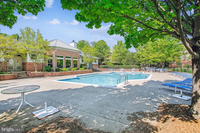 1704 Lake Shore Crest Dr Unit 32, Reston, VA 20190 - community pool with a patio and fence