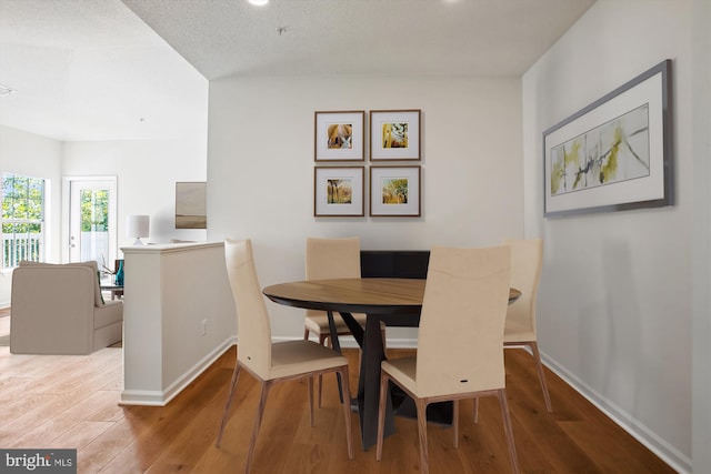 1704 Lake Shore Crest Dr Unit 32, Reston, VA 20190 - dining space with wood finished floors and baseboards