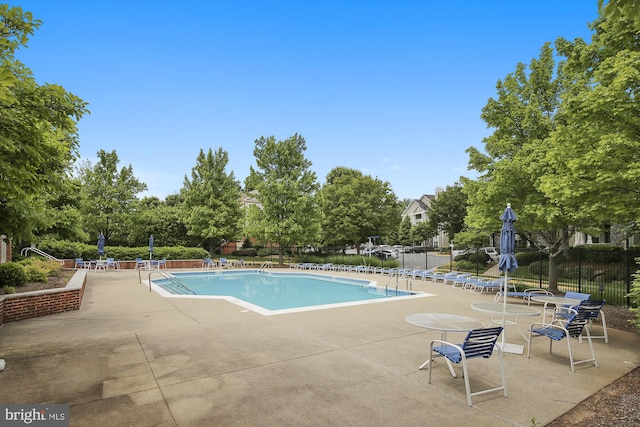 1704 Lake Shore Crest Dr Unit 32, Reston, VA 20190 - community pool featuring fence and a patio