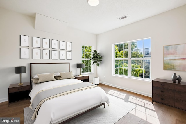 1704 Lake Shore Crest Dr Unit 32, Reston, VA 20190 - bedroom with wood finished floors and baseboards