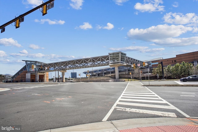 1704 Lake Shore Crest Dr Unit 32, Reston, VA 20190 - view of asphalt street featuring traffic lights, sidewalks, curbs, and street lights