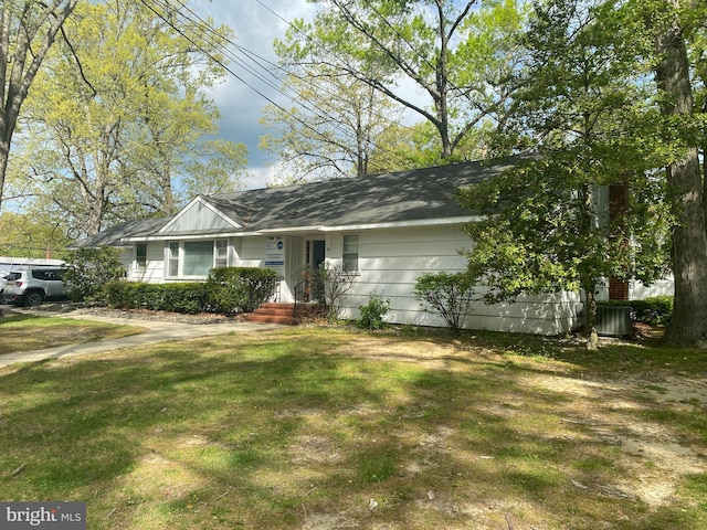 ranch-style house with a front lawn