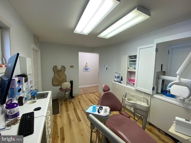 workout room with light wood-style flooring