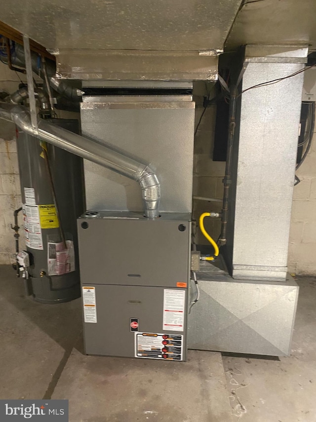 utility room with water heater