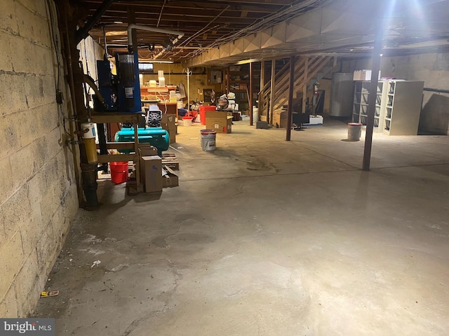 unfinished below grade area with concrete block wall