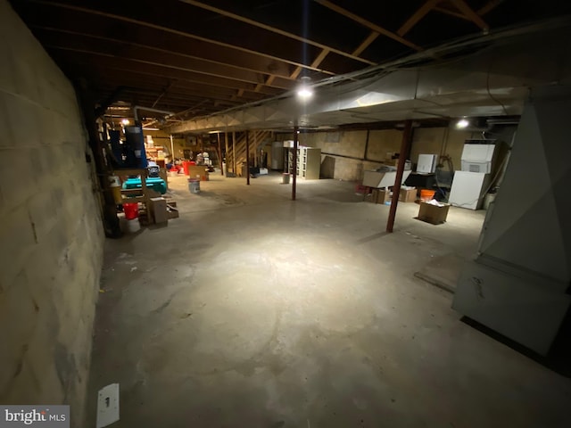 unfinished basement with water heater