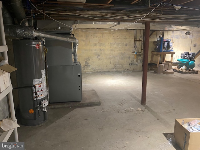 unfinished basement with heating unit and water heater