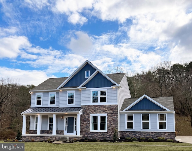 16497 Northwestern Pike, Augusta, WV 26704 - craftsman-style home with a standing seam roof, covered porch, a front yard, and stone siding