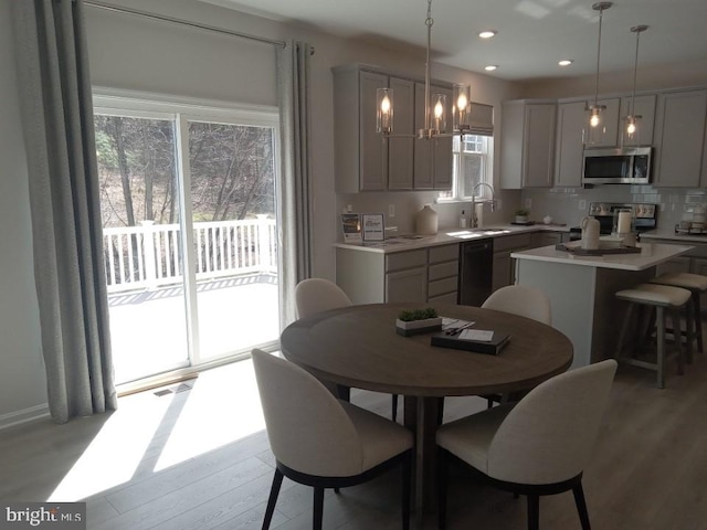 16497 Northwestern Pike, Augusta, WV 26704 - dining space with recessed lighting, a notable chandelier, visible vents, and light wood-style flooring