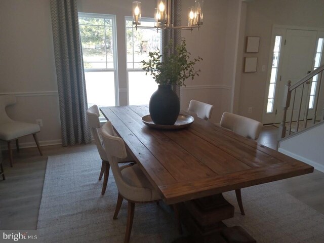 16497 Northwestern Pike, Augusta, WV 26704 - dining room with an inviting chandelier, baseboards, plenty of natural light, and stairway