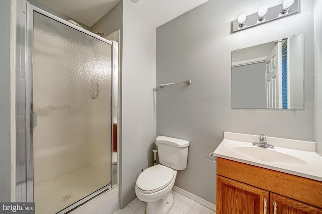 full bath with toilet, vanity, tile patterned flooring, a shower stall, and baseboards
