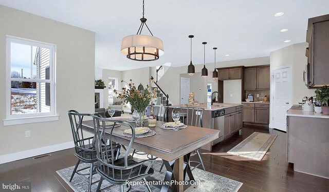 dining area with dark wood-style flooring, visible vents, stairway, baseboards, and recessed lighting