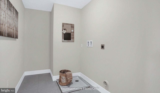 laundry room with laundry area, tile patterned flooring, hookup for a washing machine, baseboards, and hookup for an electric dryer