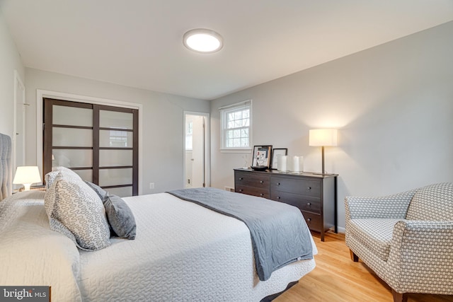 bedroom featuring light wood-style flooring