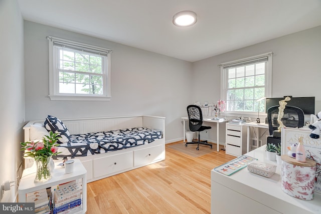 home office featuring light wood-type flooring and a wealth of natural light