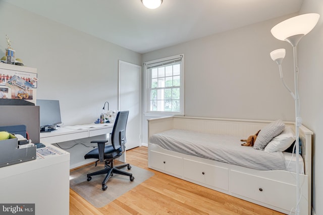 bedroom featuring light wood-style flooring