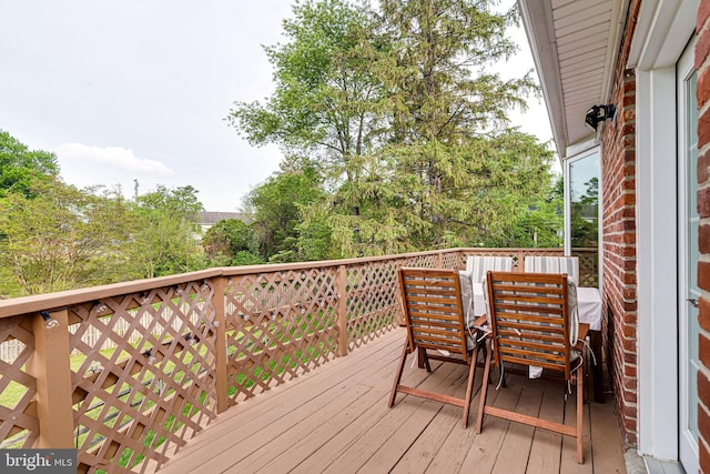 deck featuring outdoor dining area