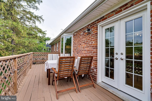 wooden deck featuring french doors