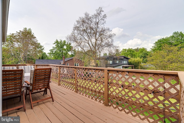 wooden terrace with outdoor dining space