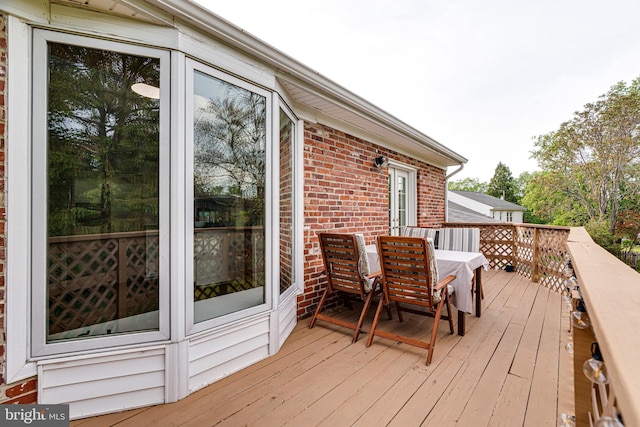 wooden deck with outdoor dining area