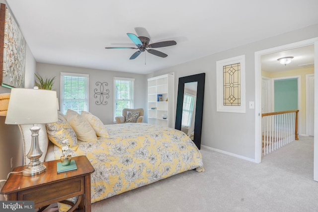 carpeted bedroom featuring baseboards