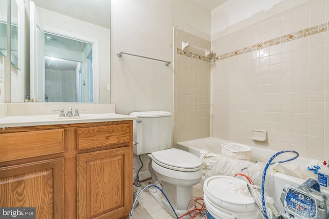 bathroom featuring vanity, tile patterned floors, tub / shower combination, and toilet